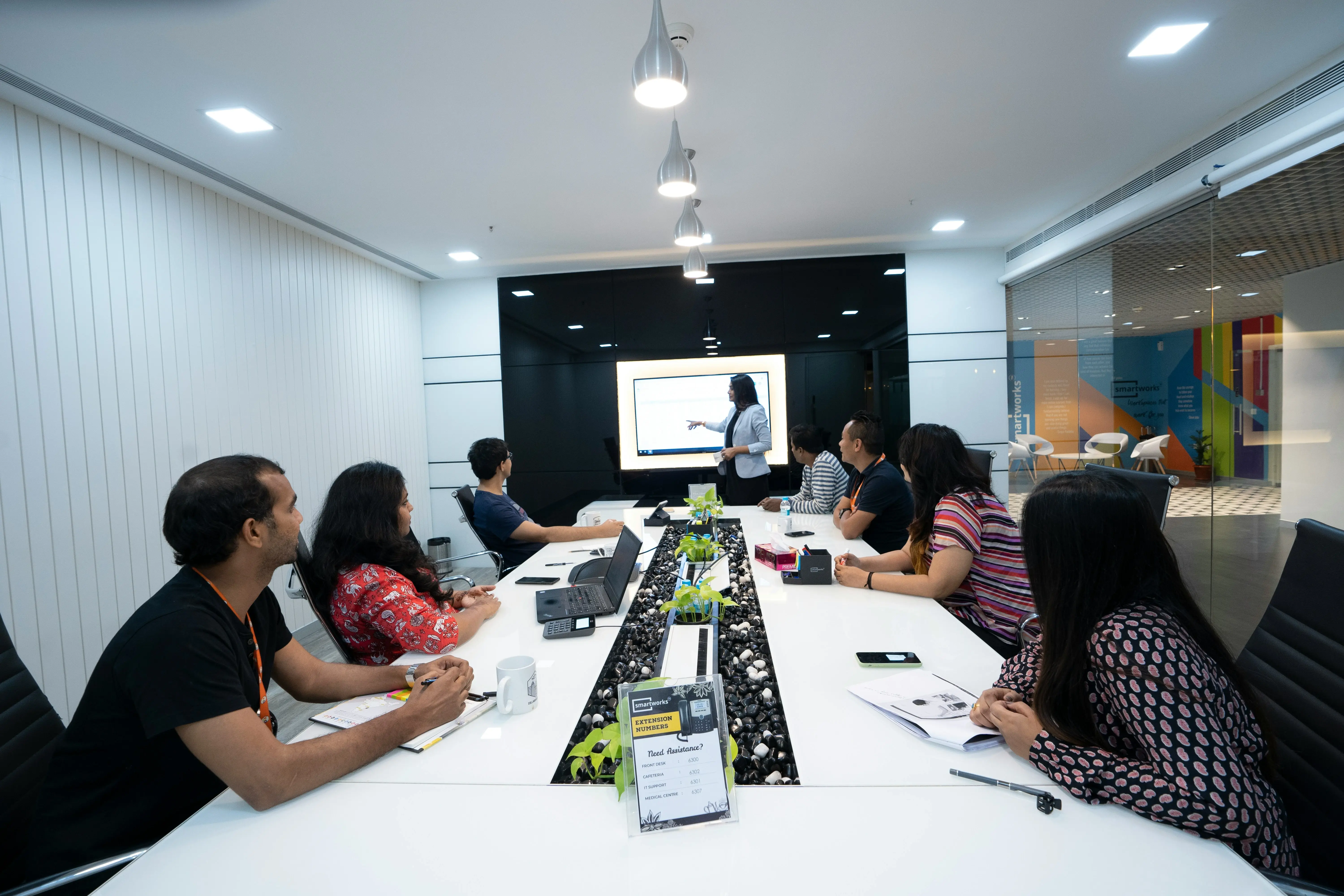 A diverse team of professionals in a planning session around a table